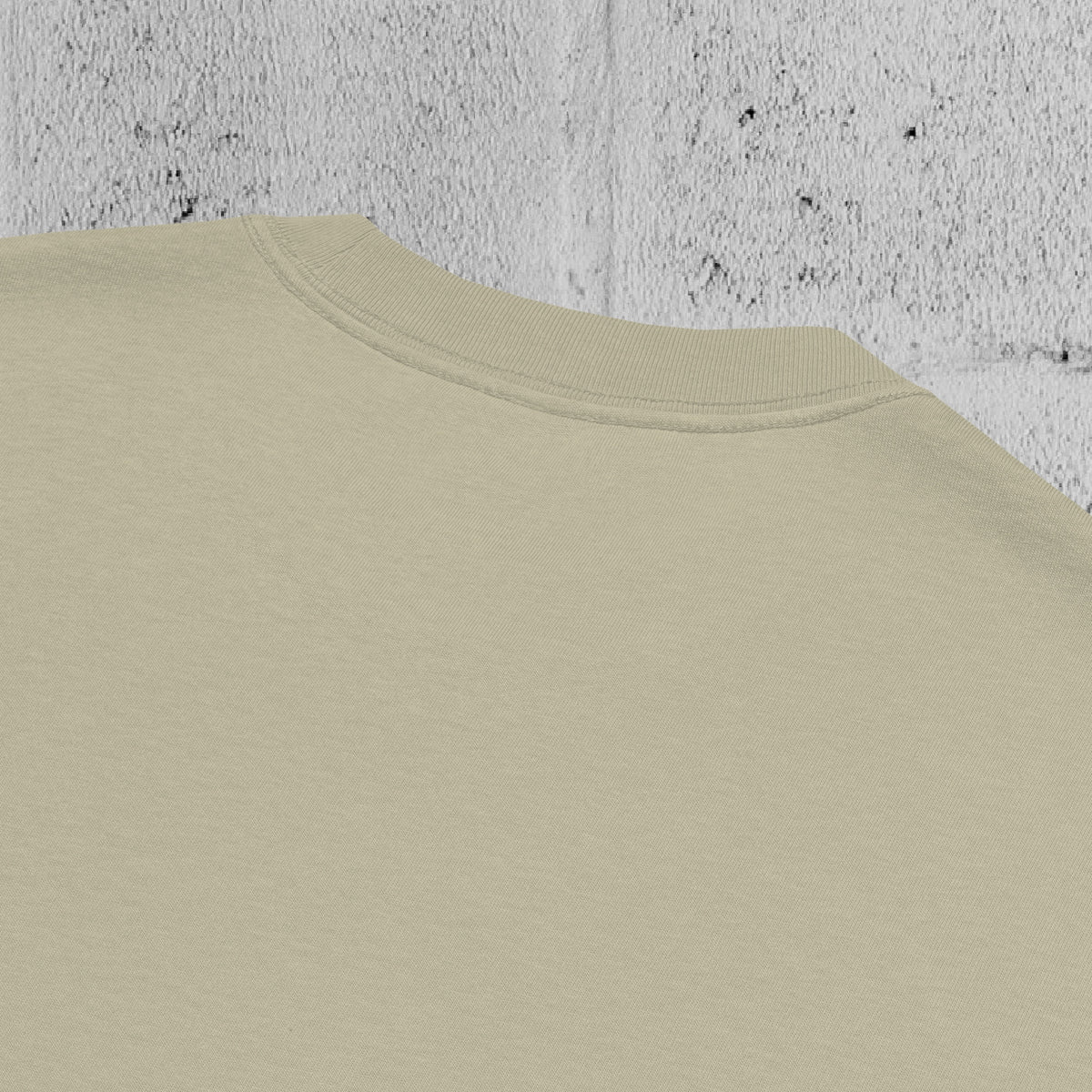 Flatlay of the UNCLASSD CORE Oversized Tee in faded green, heavyweight cotton, clean boxy design.