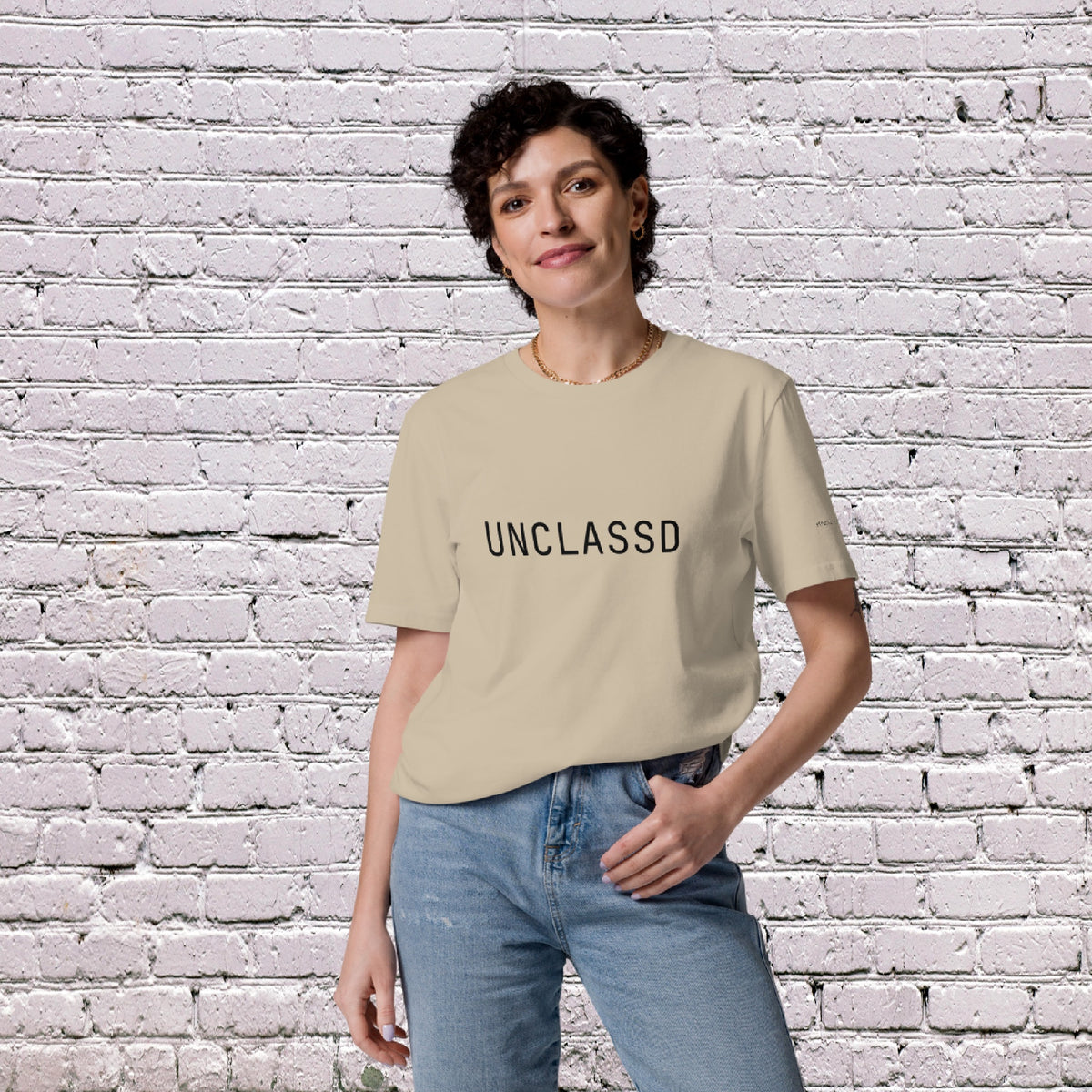 Female Model wearing UNCLASSD CORE Sand Tee during dance or rollerskate flow practice - front 