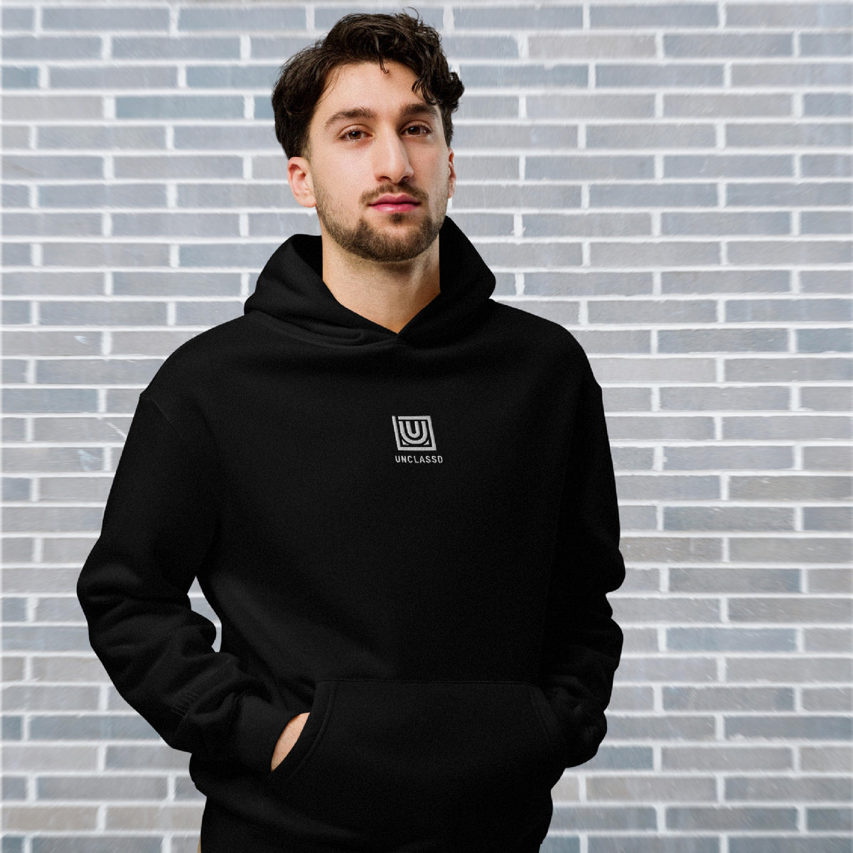 Male Dancer wearing UNCLASSD CORE oversized black hoodie for studio footwork and floorwork practices - front 
