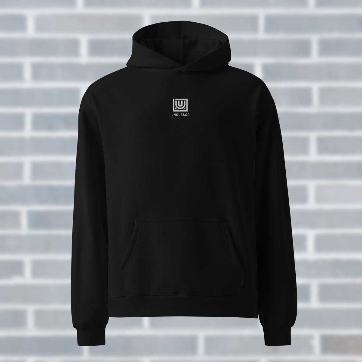 UNCLASSD CORE oversized black hoodie with small chest monogram for dancers and rollerskaters