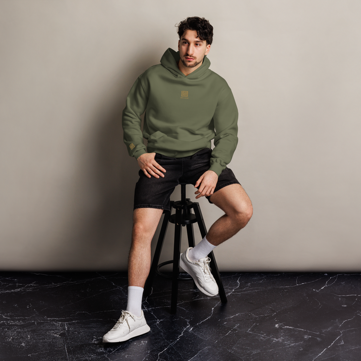 Man wearing UNCLASSD Cypress Hoodie — deep green grounding layer designed for hip-hop, house, roller dance, and everyday street movement.