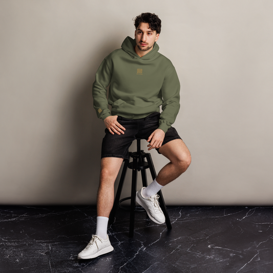 Man wearing UNCLASSD Cypress Hoodie — deep green grounding layer designed for hip-hop, house, roller dance, and everyday street movement.