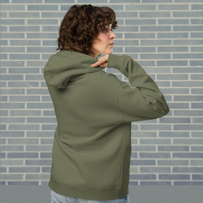 Woman wearing UNCLASSD Cypress oversized hoodie — stable earth-frequency tone for dancers, contemporary movers, and rollerskaters seeking grounded flow. back