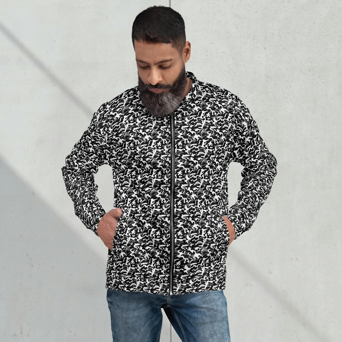 Model wearing a relaxed unisex black camouflage fleece jacket with a streetwear outfit