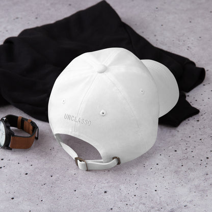 Adjustable strap with metal buckle on white dad hat