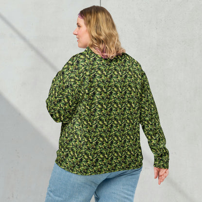 Model wearing a relaxed unisex green camouflage fleece jacket with a casual