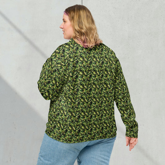 Model wearing a relaxed unisex green camouflage fleece jacket with a casual