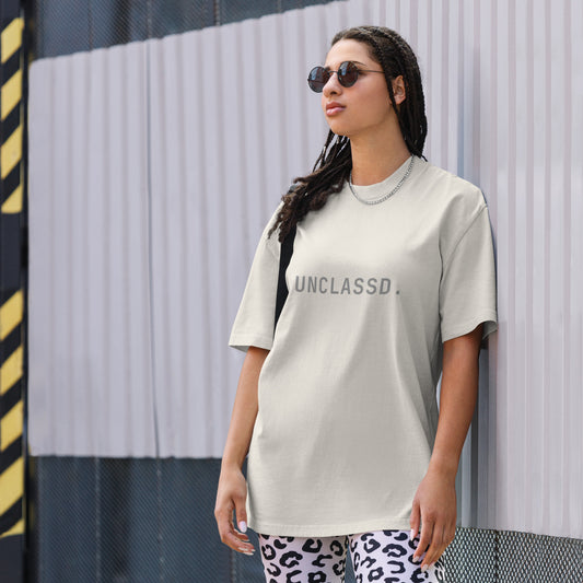 Side profile of the UNCLASSD CORE Oversized Tee, highlighting the structured drape and oversized silhouette.