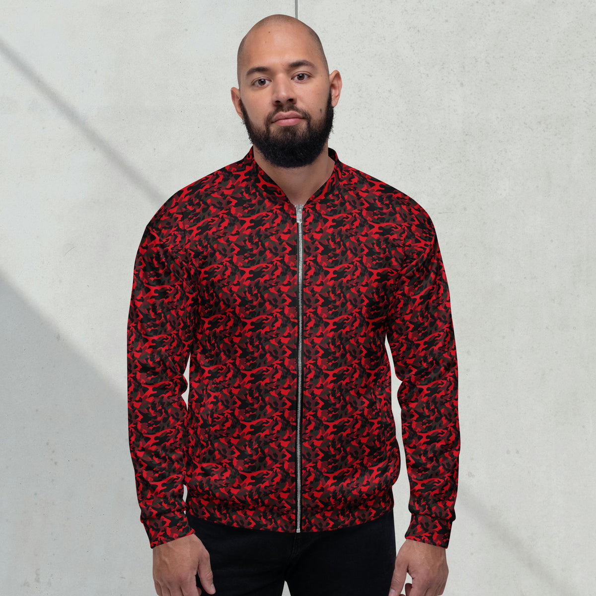 Model wearing a relaxed unisex red camouflage fleece jacket with a streetwear outfit